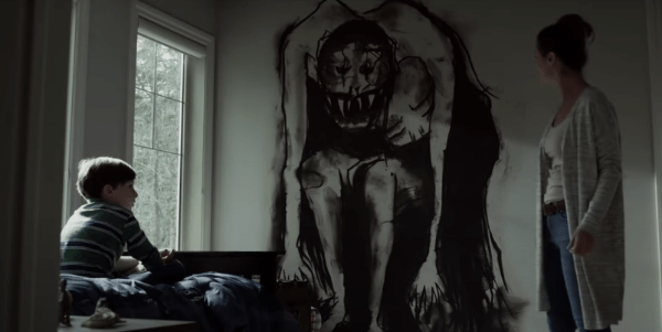Mom and son in bedroom looking at a scary monster drawing on the wall in Z