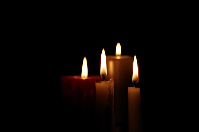 Lit candles in the dark