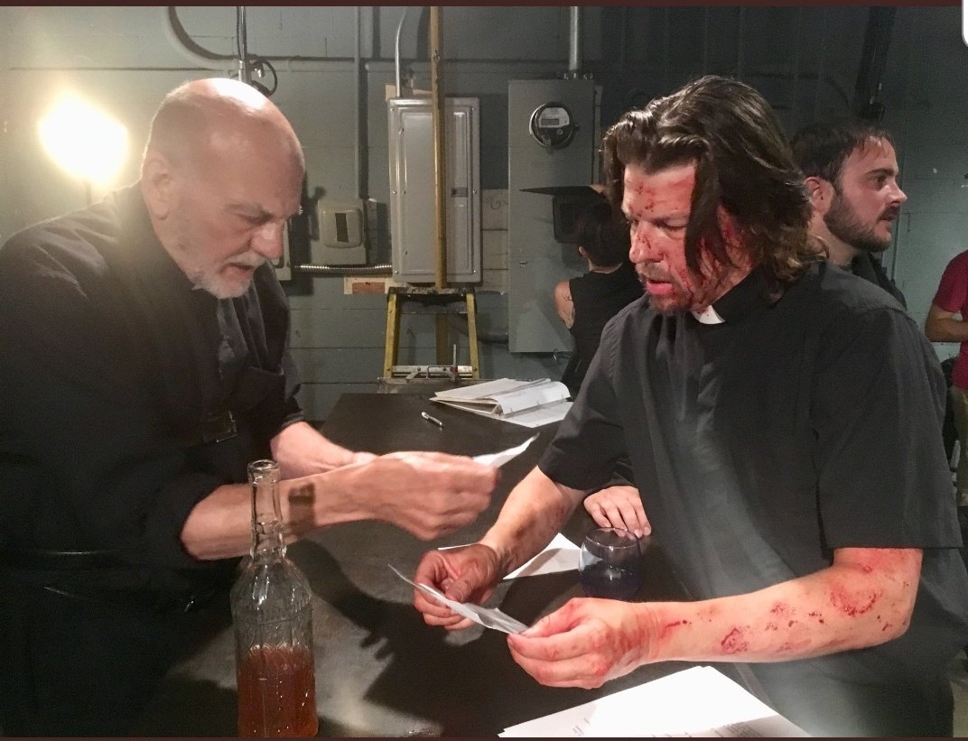 Carmen Argenziano (Father Gabe) and Kyle Hester (Father Joshua) going over Preacher Six's script, behind-the-scenes.