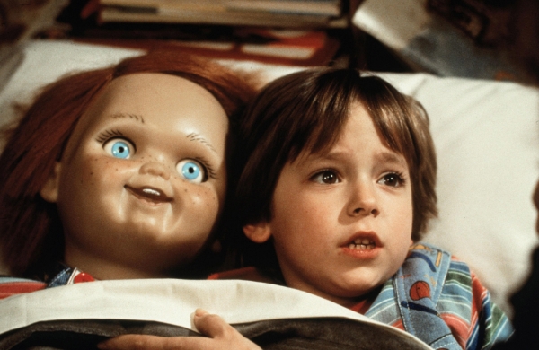 Andy and Chucky tucked into bed in Child's Play