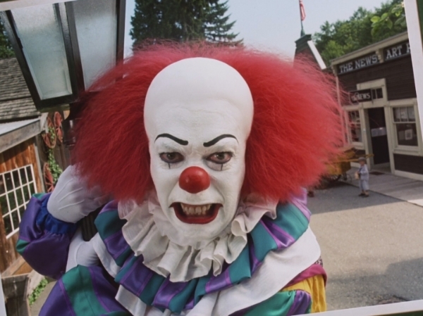 Tim Curry as Pennywise in It 1990