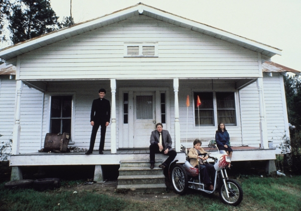 the main cast of Silver Bullet posed outside a house