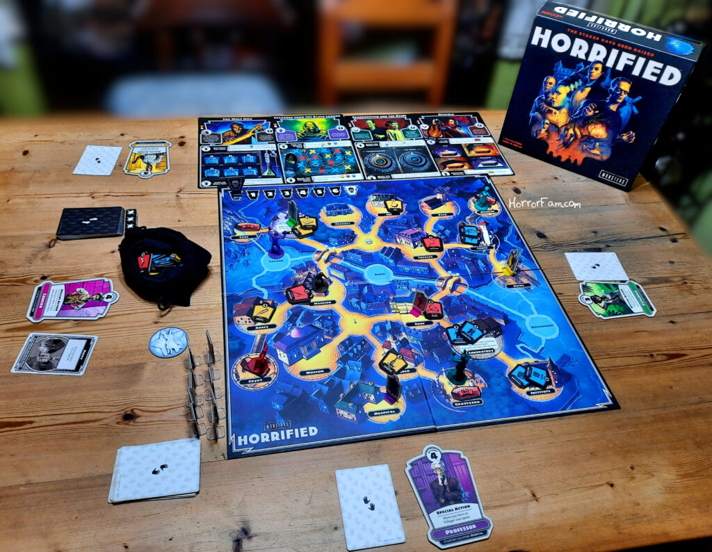 Ravensburger's Horrified: Universal Monsters displayed on a wooden table.